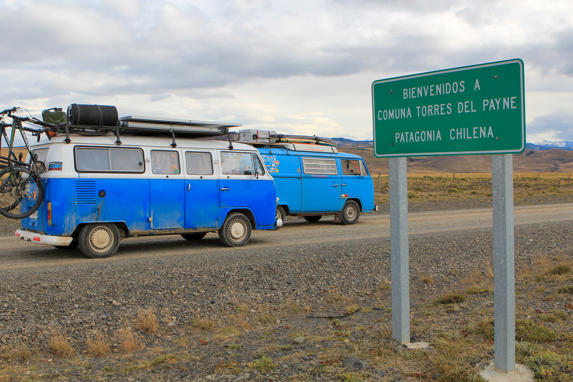 two volkswagen kombis in a road in chilean Patagonia